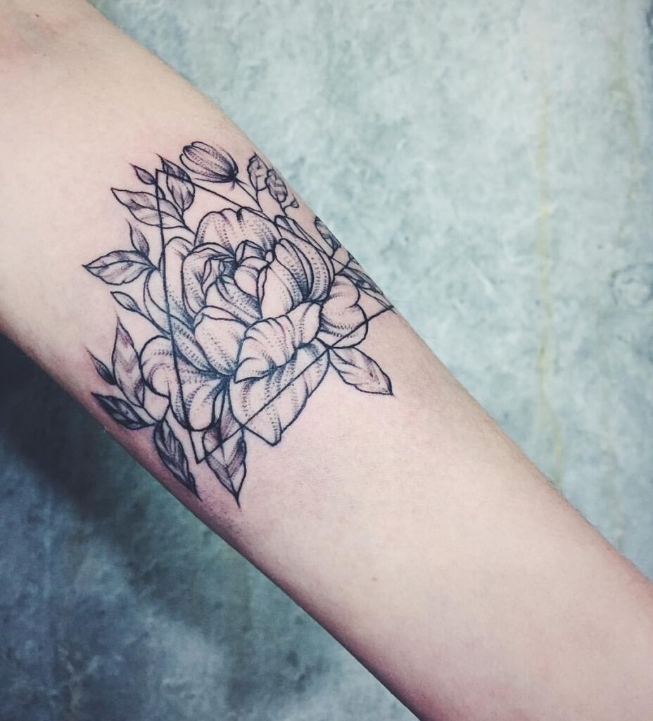 Peony tattoo on the forearm for women