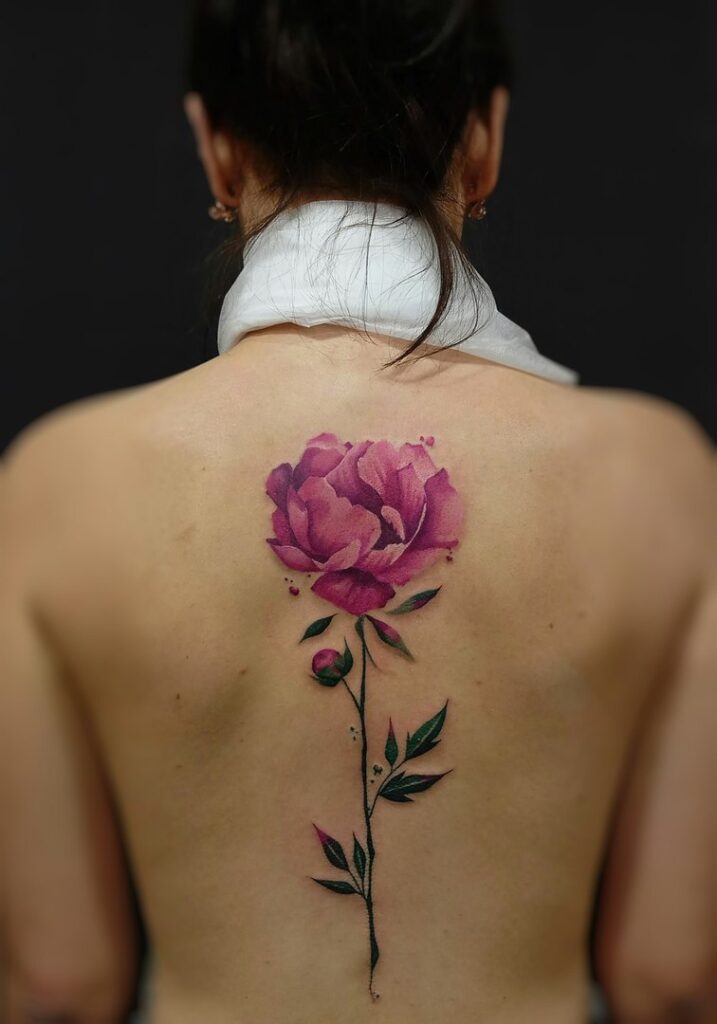 Large peony tattoo on the back for women