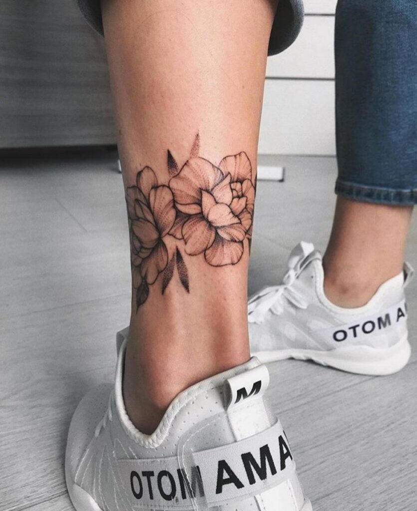 Peony tattoo on the calf for women