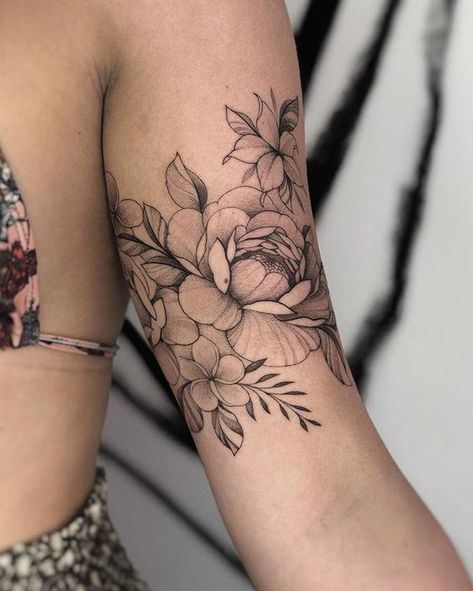 Peony tattoo on the shoulder for women