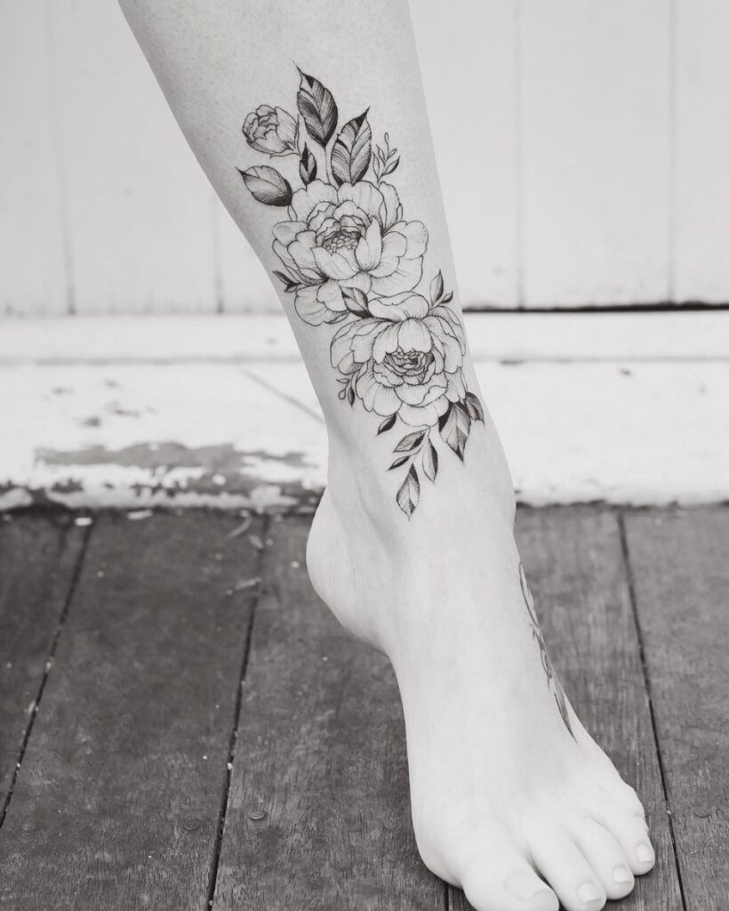 Peony tattoo on the shin for women