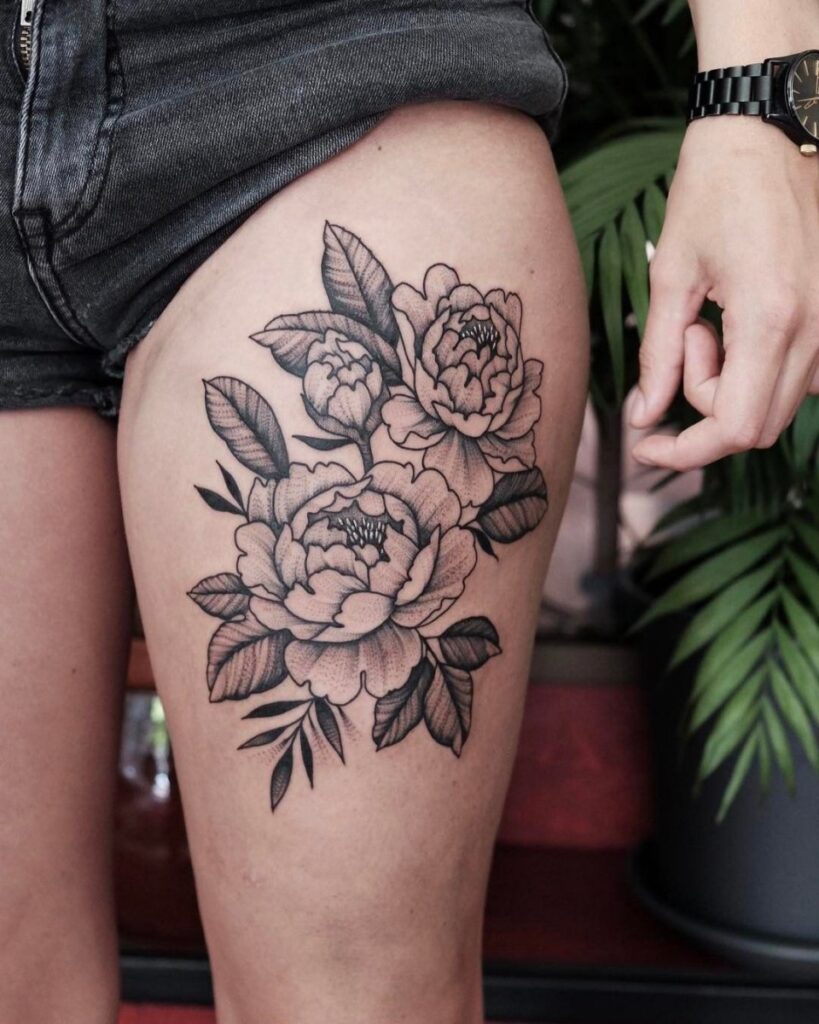 Peony tattoo on the hip for men