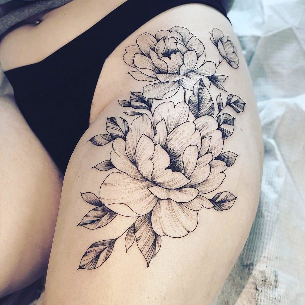 Large peony tattoo on the thigh for women