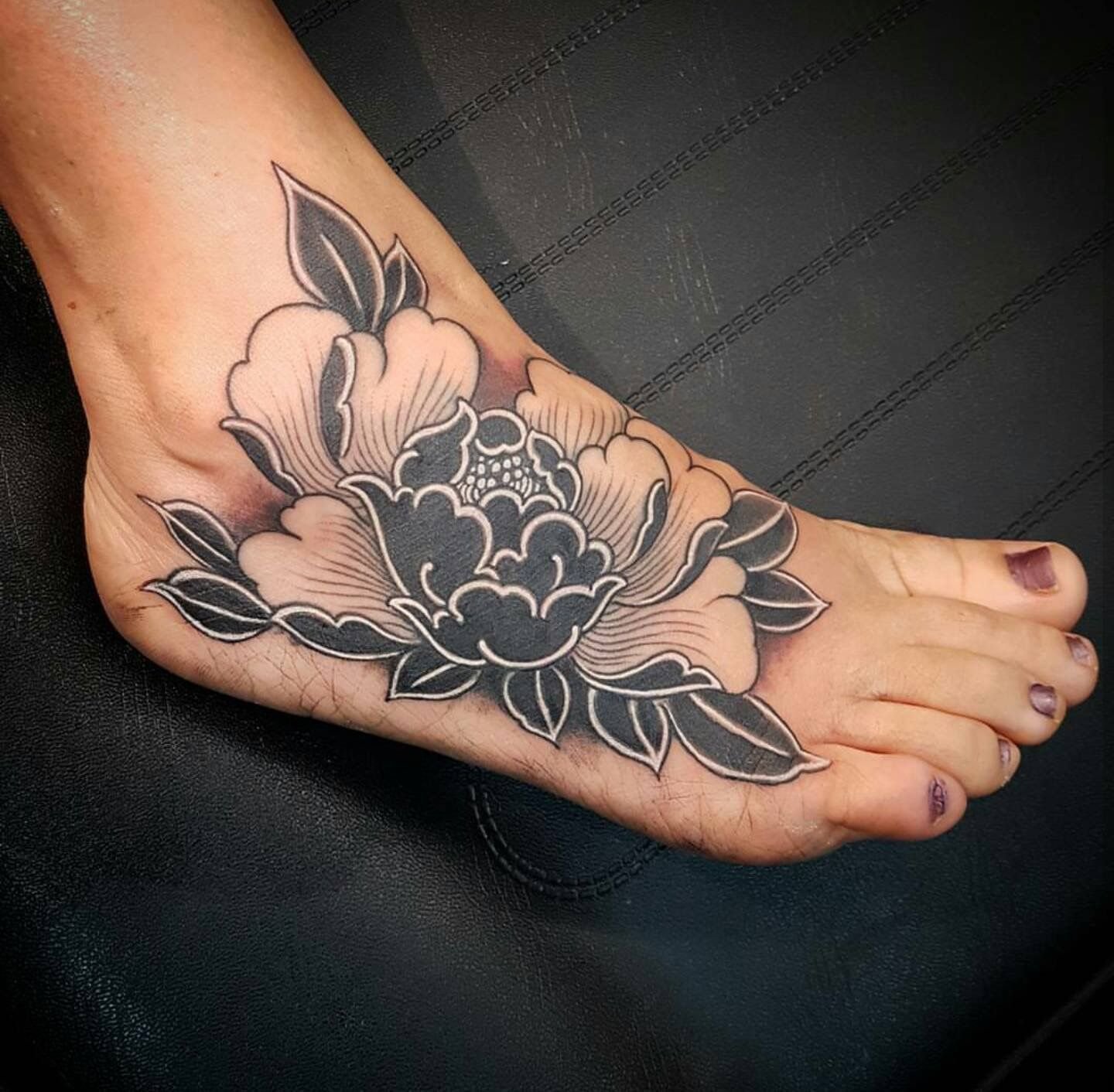 Peony tattoo on the ankle for women