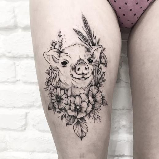 Pig tattoo on the thigh for women