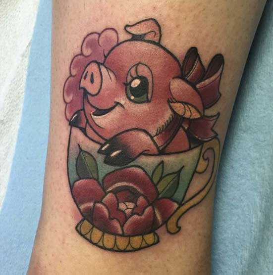 Pig tattoo on the thigh for women