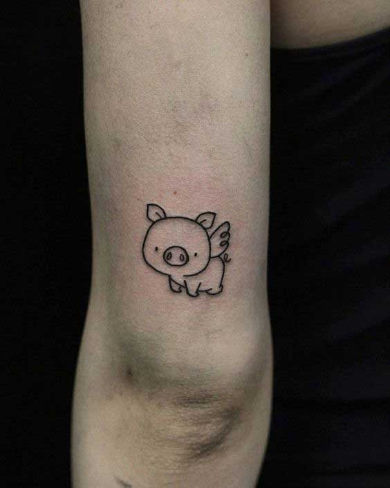 Pig tattoo on the shoulder for women