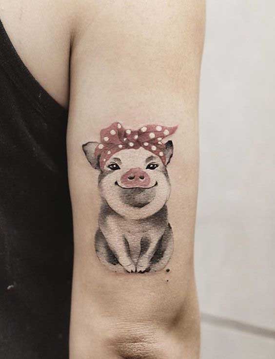 Pig tattoo on the forearm for women