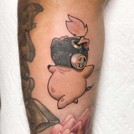 Pig tattoo on the shin for women