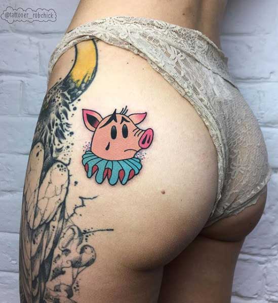 Pig tattoo on the thigh for women