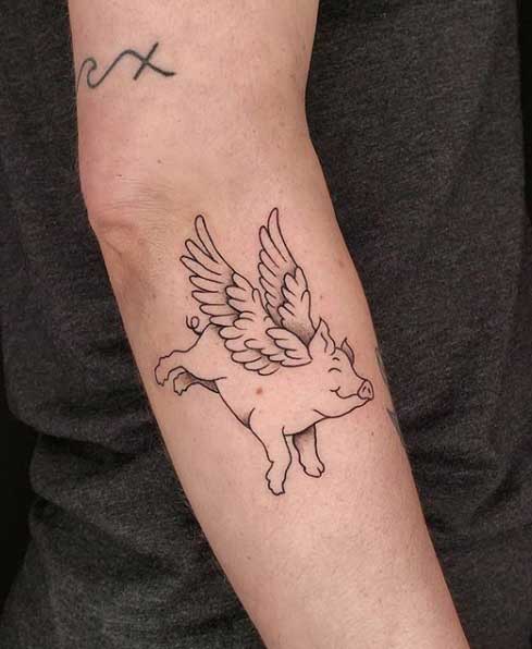 Pig tattoo on the forearm for men