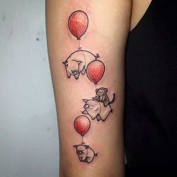 Pig tattoo on the forearm for women