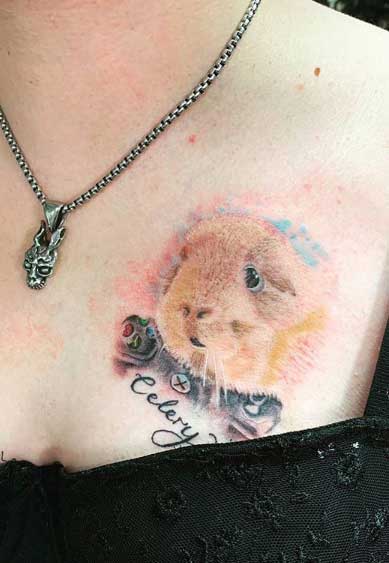 Guinea pig tattoo on the chest for women