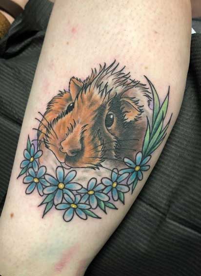 Guinea pig tattoo on the shin for women