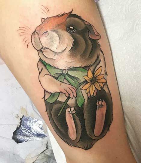 Guinea pig tattoo on the shin for women