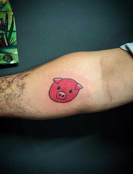 Pig tattoo on the forearm for men