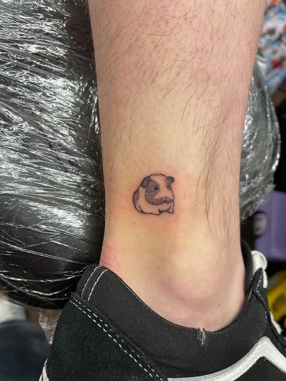 Guinea pig tattoo on the ankle for men