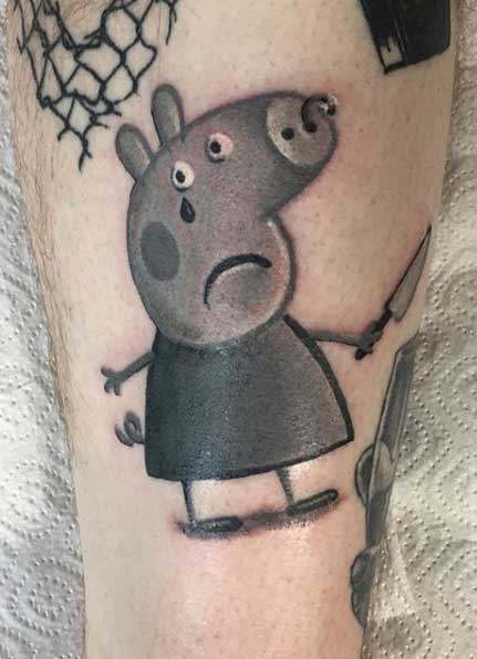 Peppa pig tattoo on the shin for men