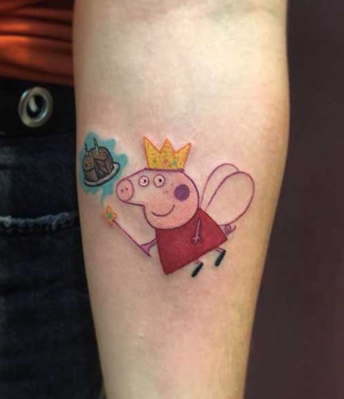 Peppa pig tattoo on the forearm for women