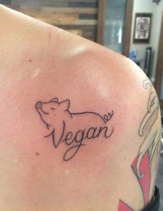 Tattoo of a pig on the shoulder for men