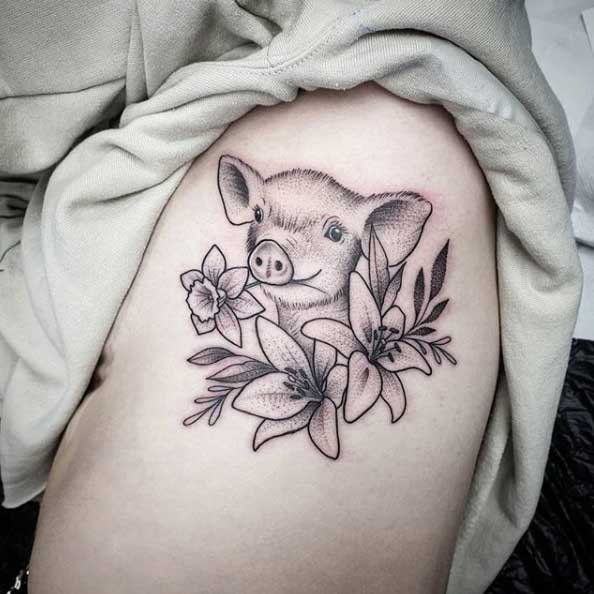 Pig tattoo on the thigh for women