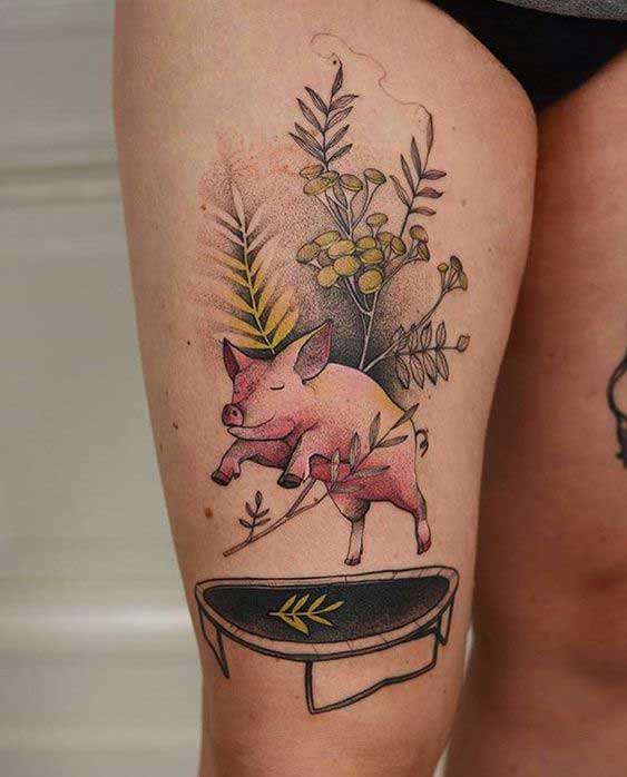 Pig tattoo on the thigh for women