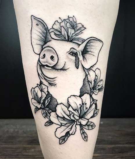 Pig tattoo on the leg for women