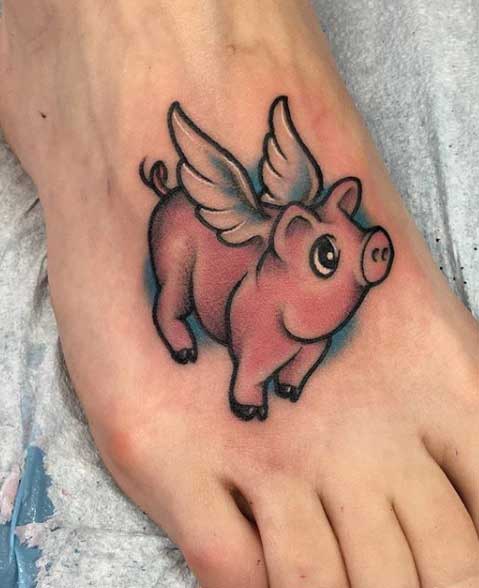 Tattoo of a pig on the ankle for men