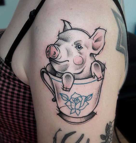 Pig tattoo on the shoulder for women