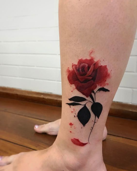 Colorful rose tattoo on the shin for women