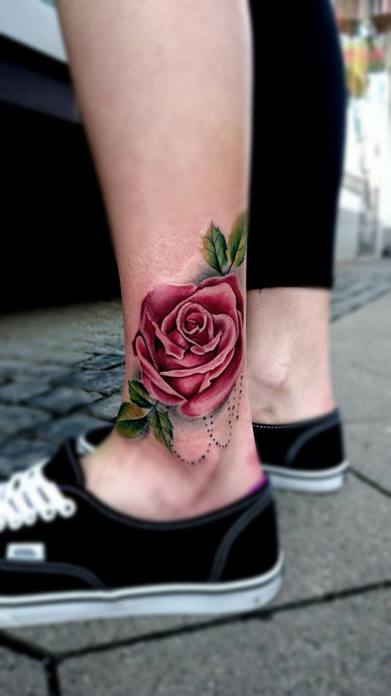 Colorful rose tattoo on the shin for men