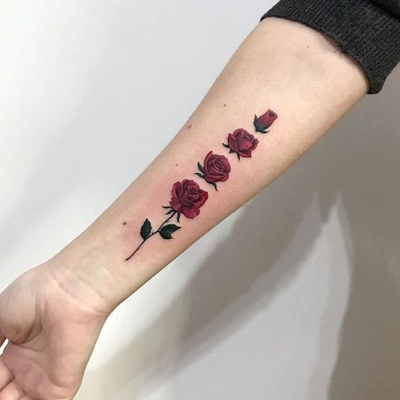 Colorful rose tattoo on the forearm for men