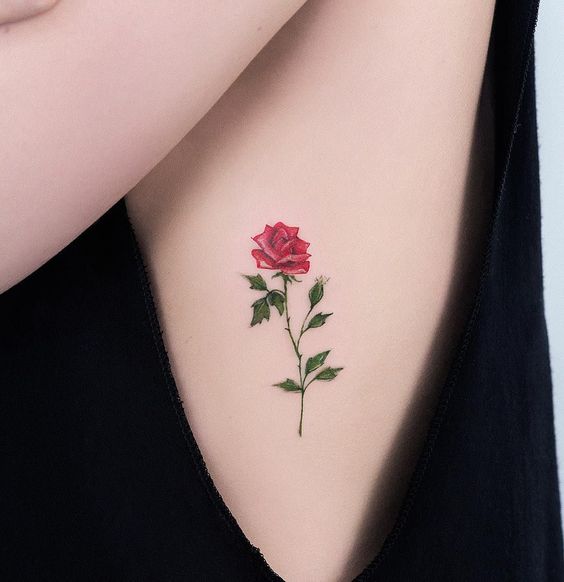 Colorful rose tattoo on the side for women