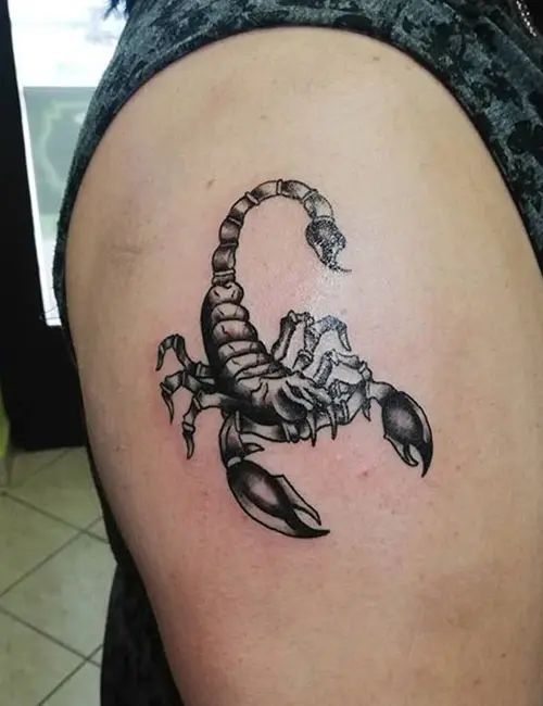 Tattoo of a scorpion on the shoulder for women