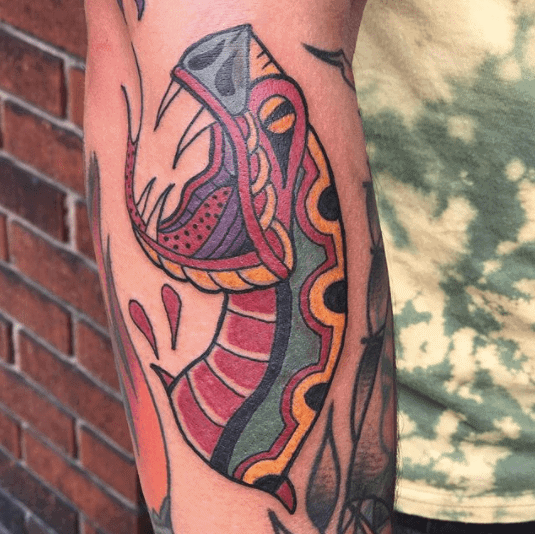 Snake tattoo on the forearm for men