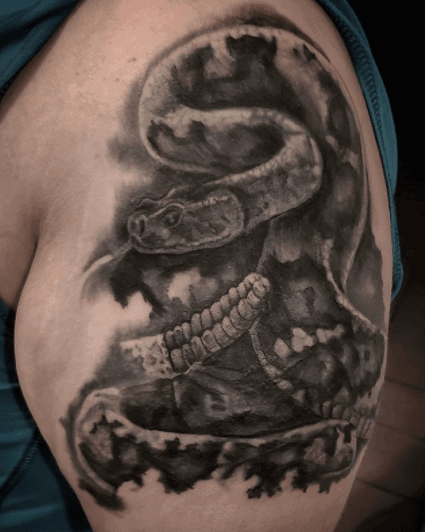 Rattlesnake tattoo on the shoulder for men