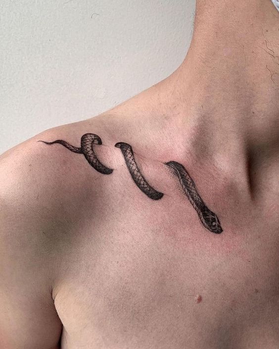 Snake tattoo on the collarbone for men