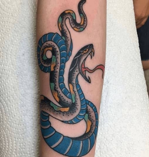 Snake tattoo on the forearm for women