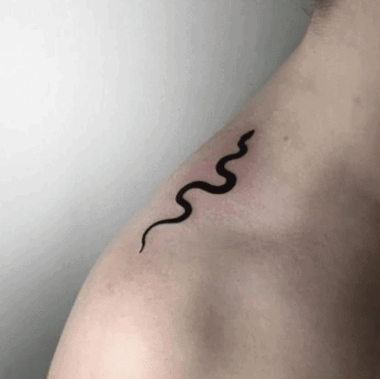 Tattoo of a small snake on the shoulder for men