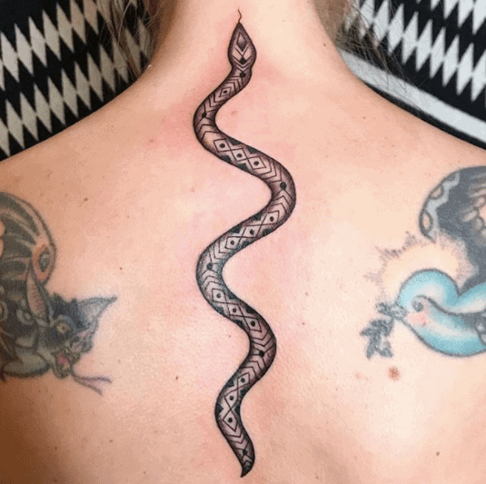 Snake tattoo on the back for women