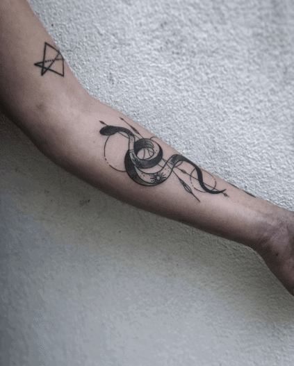 Snake tattoo on the forearm for women