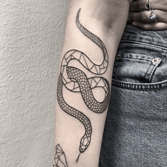 Snake tattoo on the forearm for men