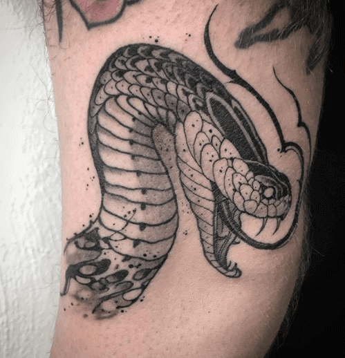 Snake head tattoo on the shoulder for men