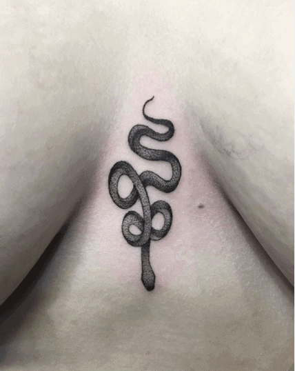 Crowley snake tattoo on the chest for women