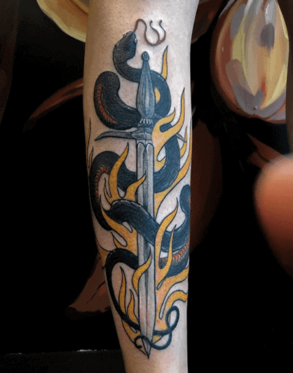 Crowley snake tattoo on forearm for men