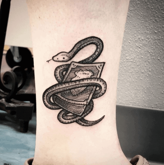 Crowley snake tattoo on the shin for men