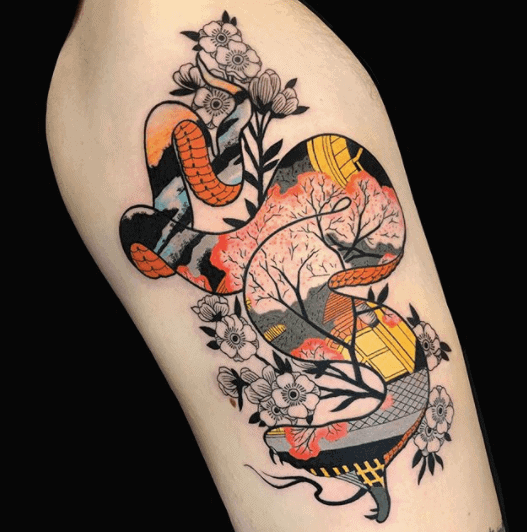 Tattoo of a colored snake on the shoulder for men