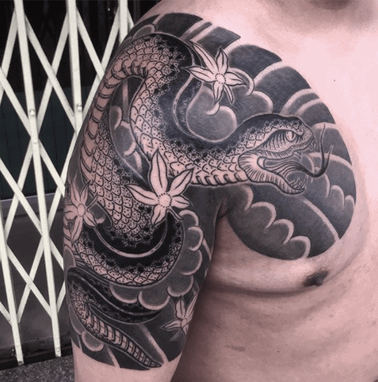 Snake tattoo on the arm for men