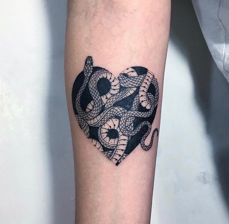 Snake tattoo on the forearm for men