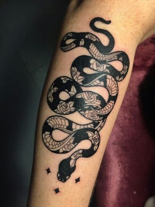 Snake tattoo on the shin for women